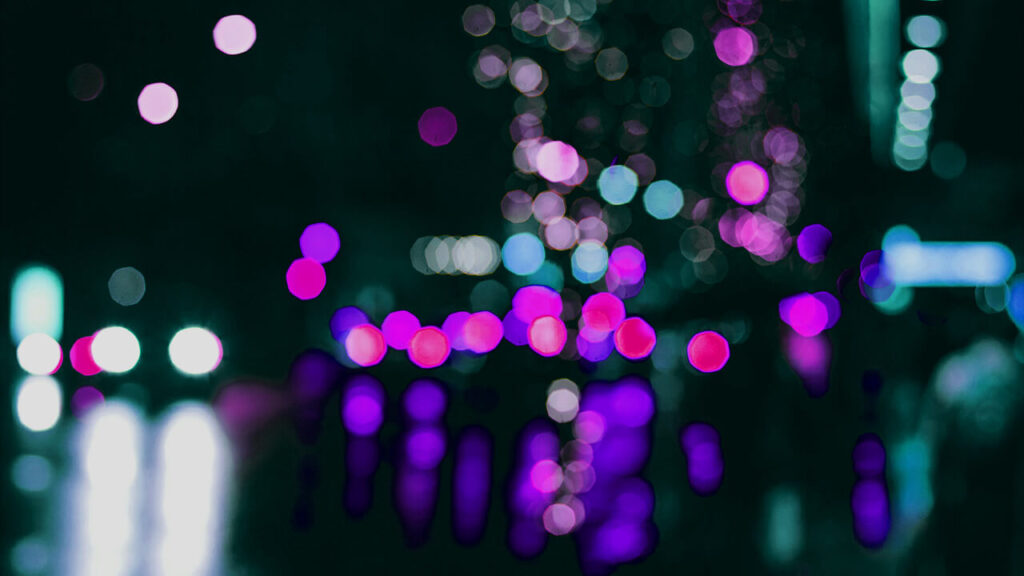 street lights and car headlights teal and purple bokeh